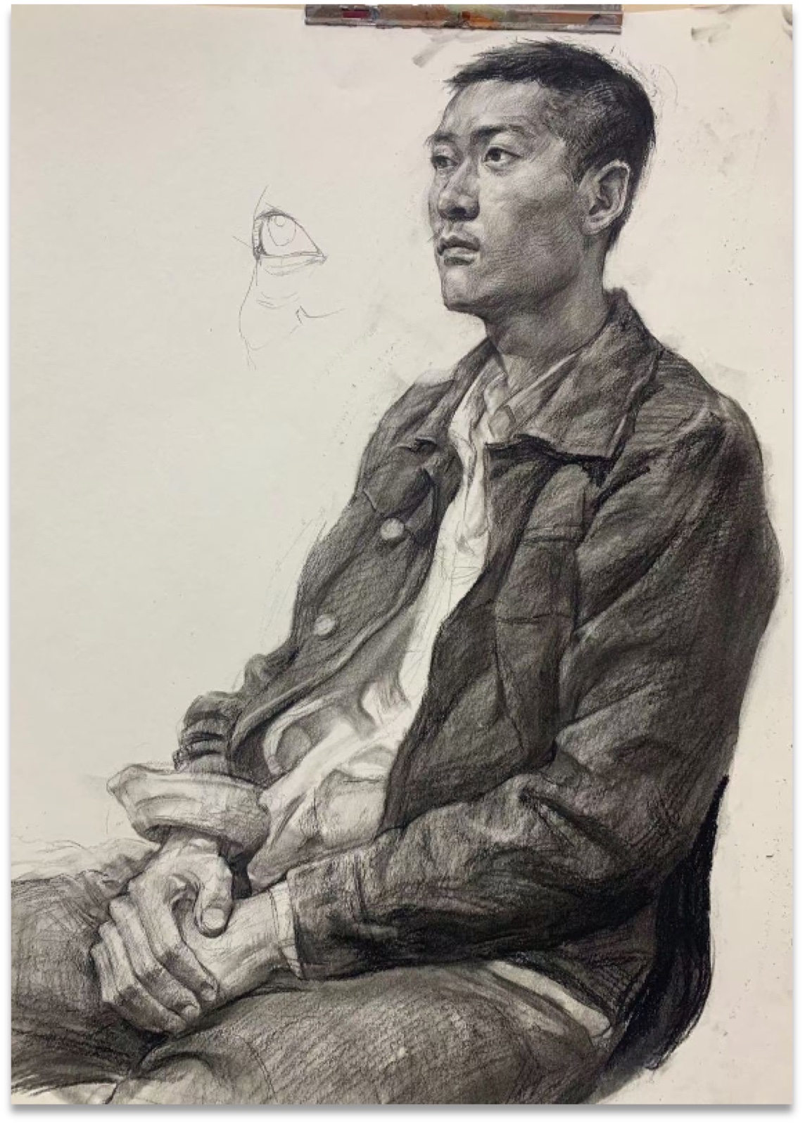 Charcoal portrait study of a seated man