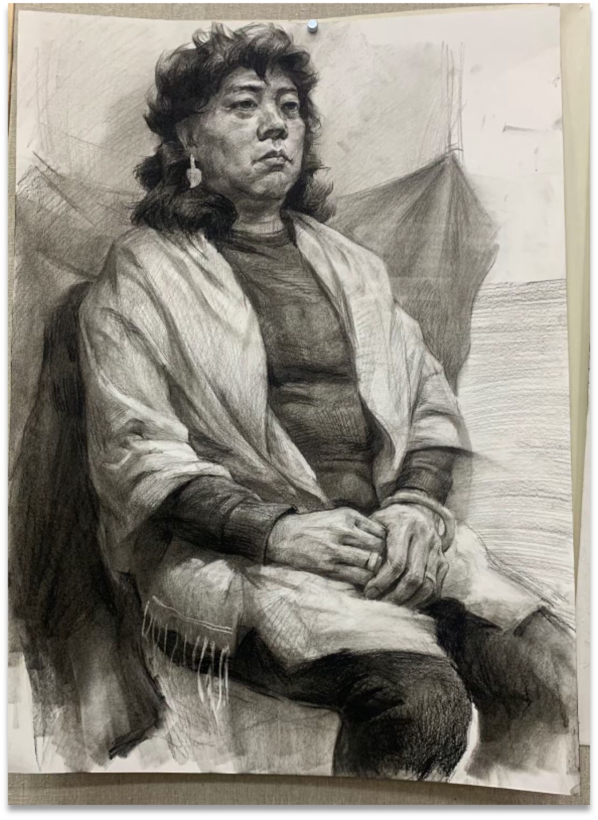 Charcoal portrait study of a seated woman